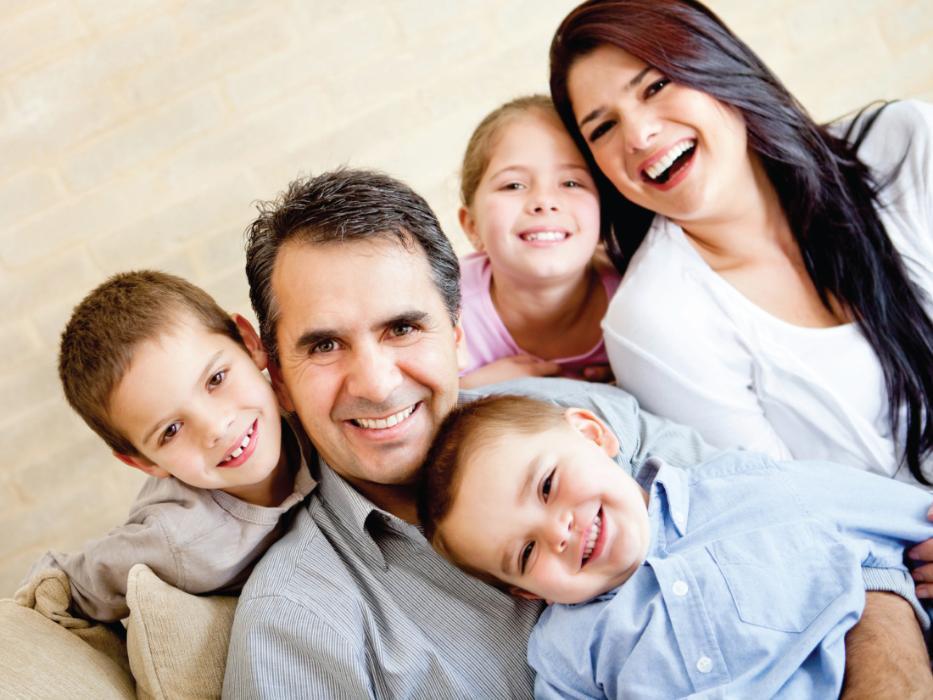 Family of dental patients smiling at Springfield dentist office