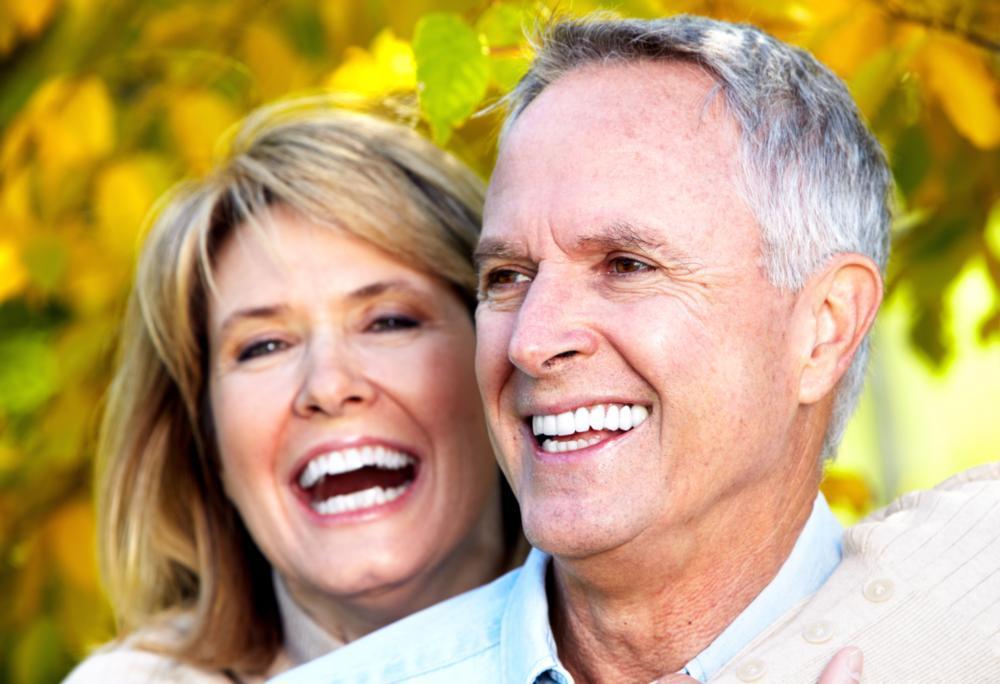 Happy couple with white teeth smiling near Springfield IL