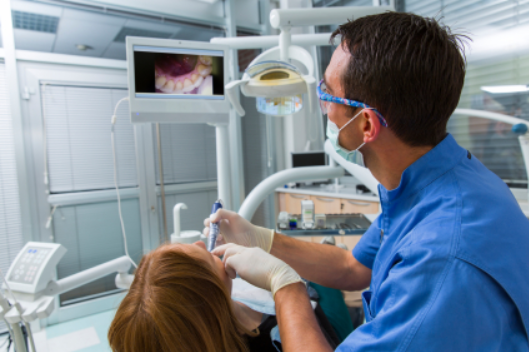 Springfield, IL dentist performing a dental exam with an intraoral camera