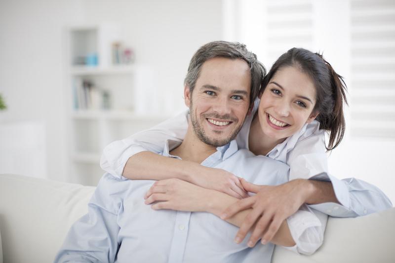 Couple sitting on couch at dentist office in Springfield IL