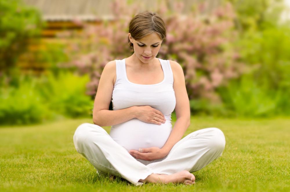 Pregnant Dental Patient sitting outside near Springfield IL