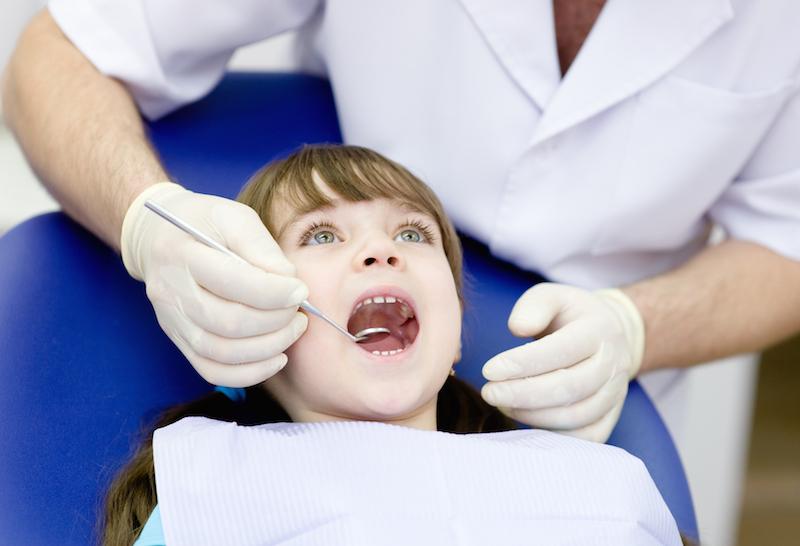 Dentist in Springfield IL examining a pediatric patient