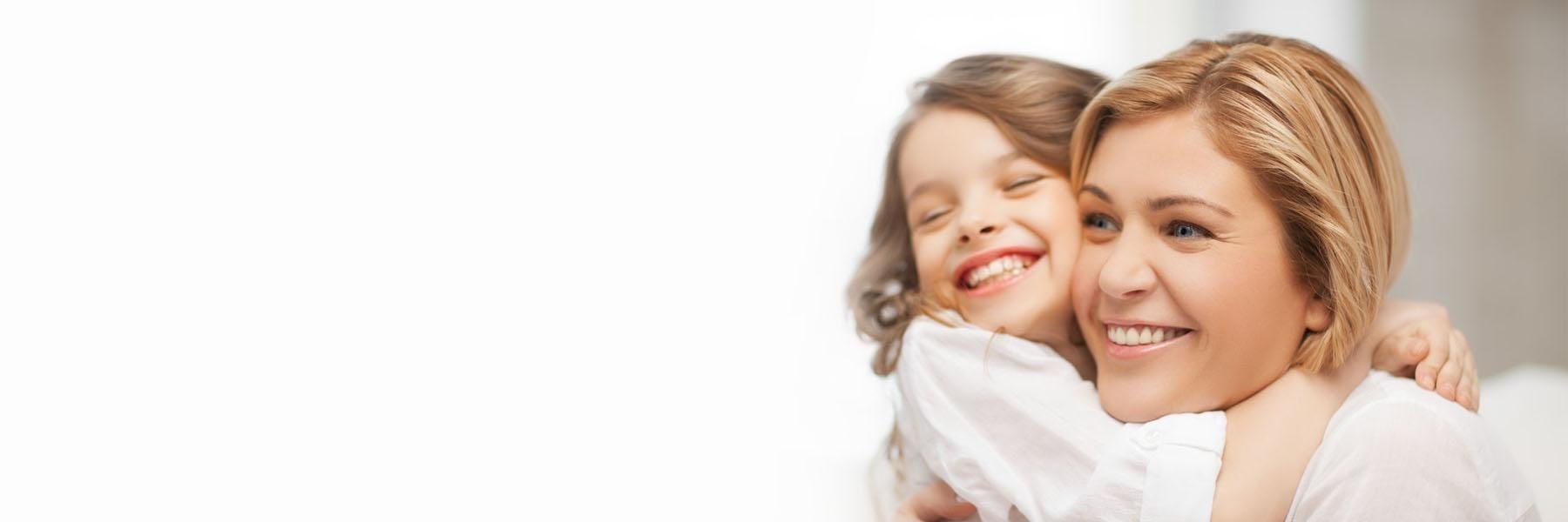 Mother and daughter smiling at best dentist in Springfield IL