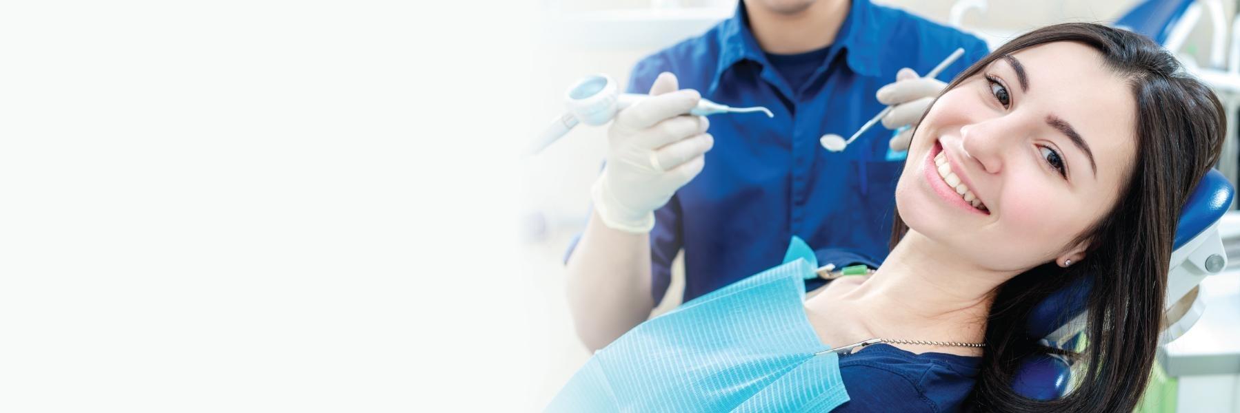 Woman at dentist for porcelain veneers in Springfield IL