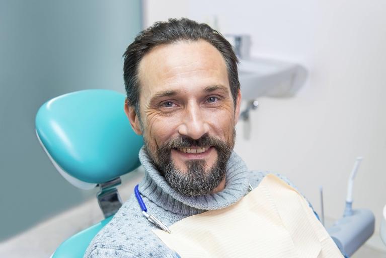 Patient in treatment chair for dentures in Springfield IL