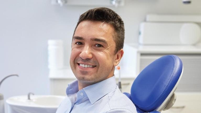 Man in Dentist Chair | Ruggless Dental