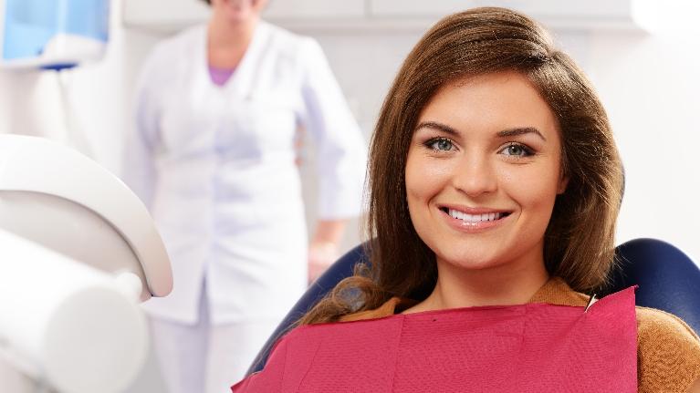 woman smiling in the dental chair | dentist springfield il