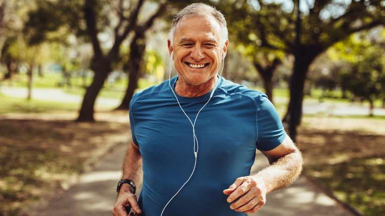 man jogging while listening to music