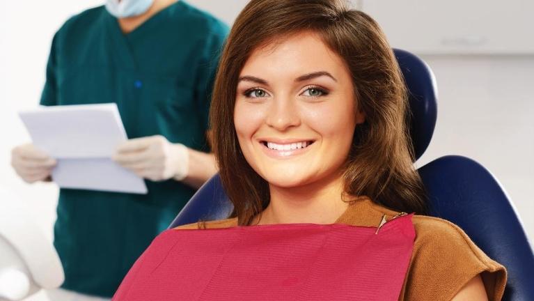 Patient in treatment chair for dental extraction in Springfield IL