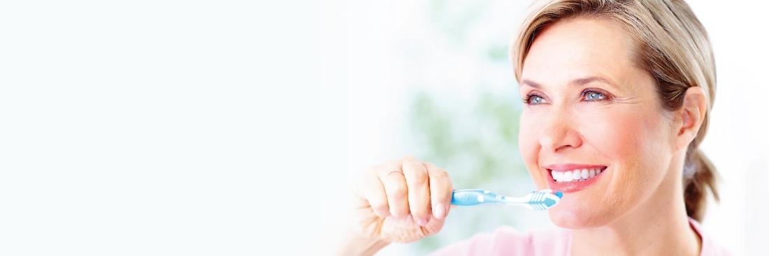 woman brushing teeth