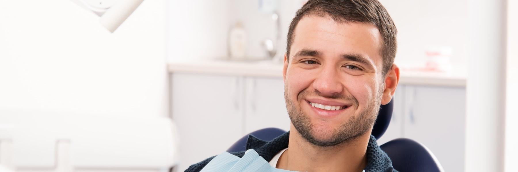 Man smiling in chair at dentist near me Springfield IL