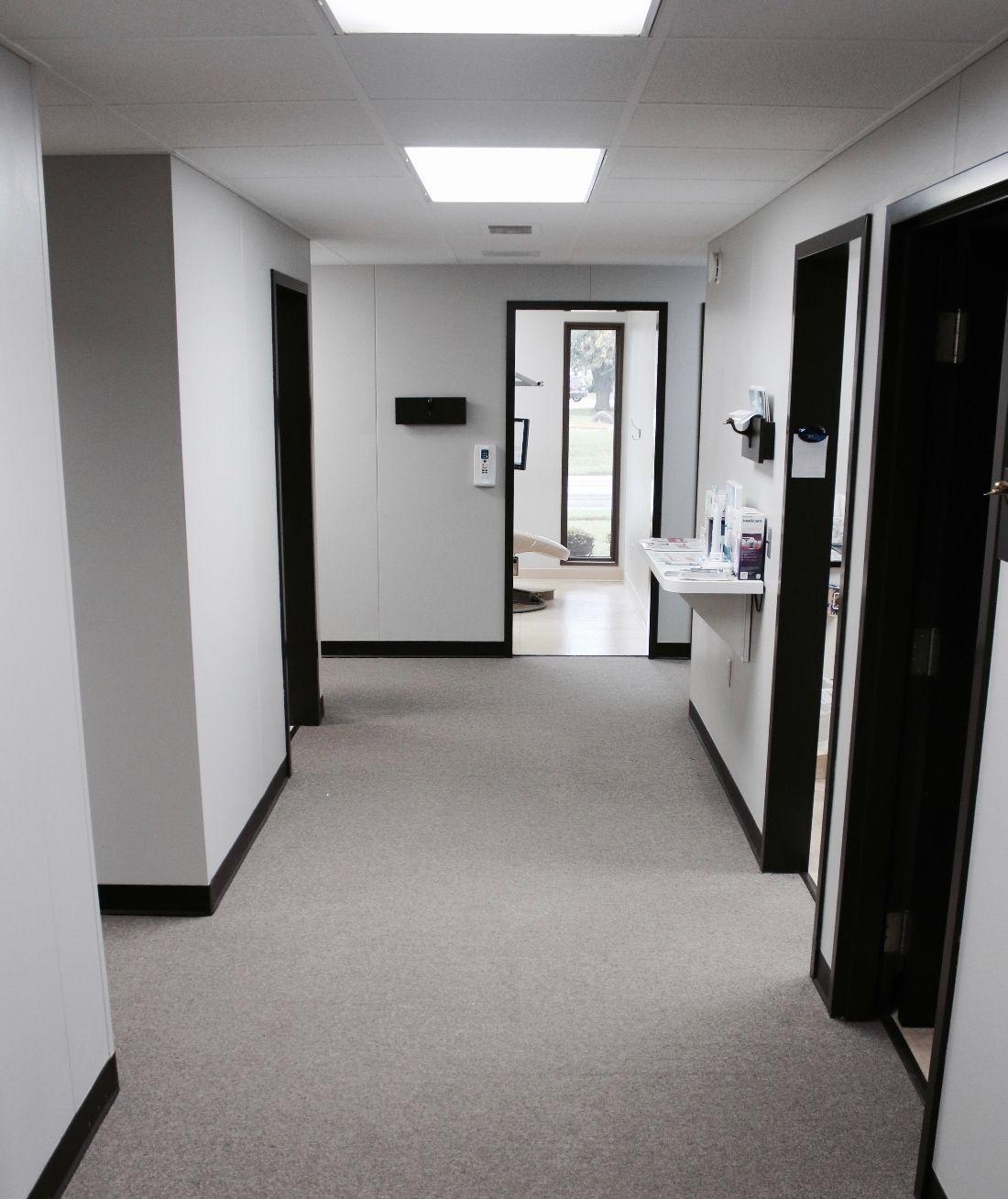 Hallway of dental treatment rooms at Ruggless Dental in Springfield, IL