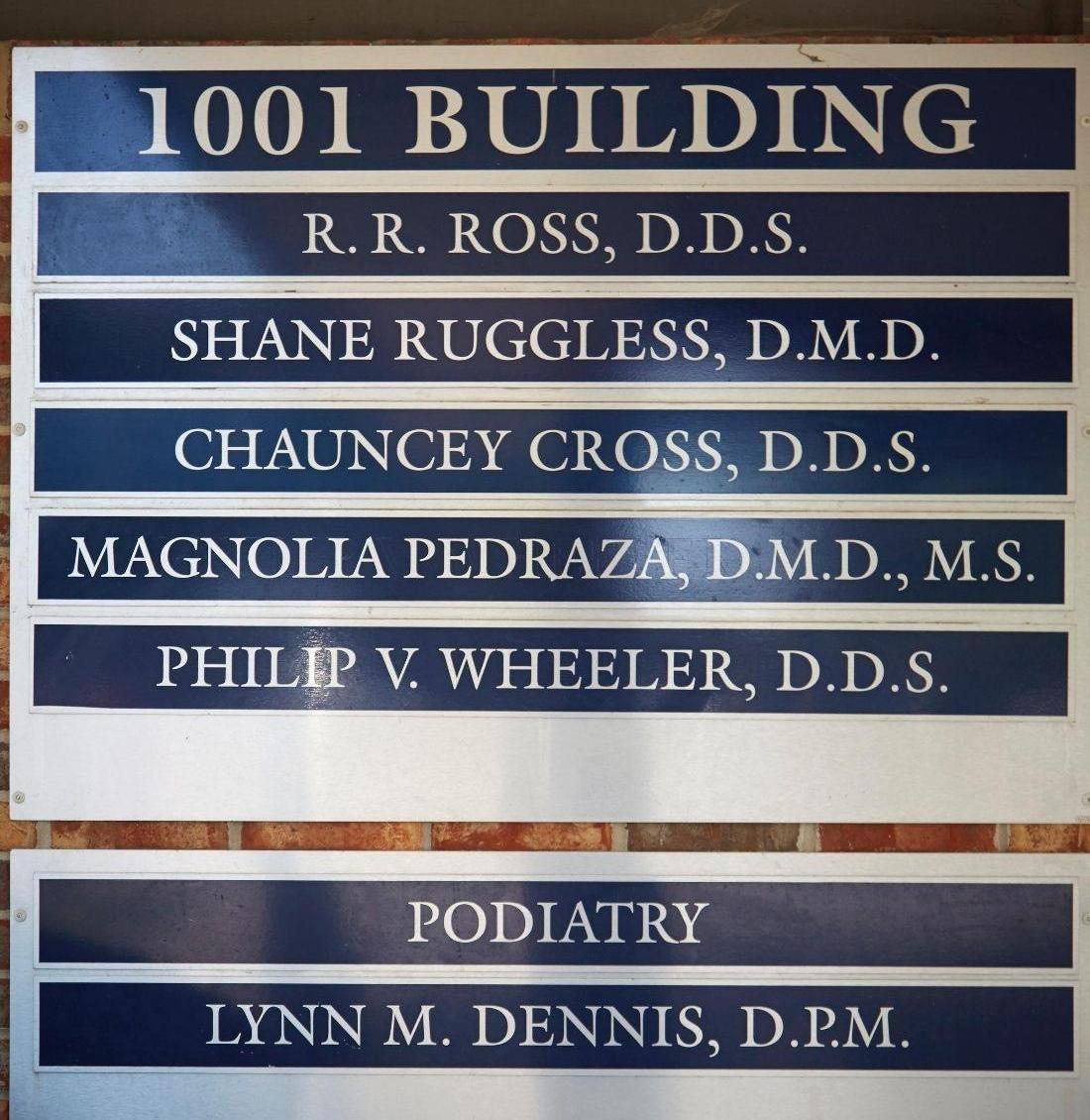 Office sign showing Shane Ruggless, DMD at 1001 Clocktower Drive, Springfield, IL